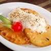 Piña gratinada con coco